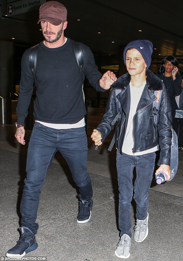 Hat's off to you! Beckham and his teenage boy both wore coordinating hats for the flight home 