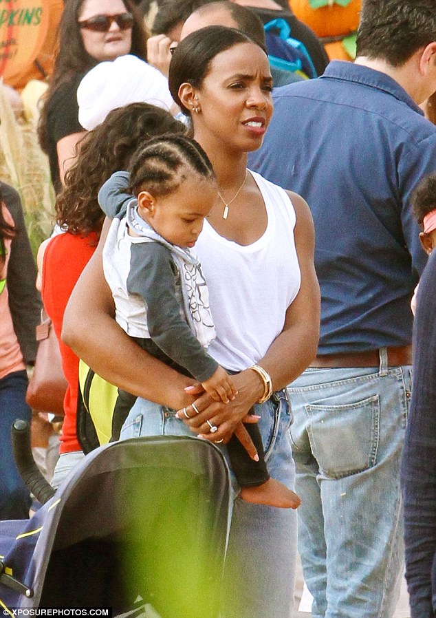 Adorable: Kelly Rowland, 34, treated her little boy Titan, 11 months, to a family day out at Mr. Bones' Pumpkin Patch in Culver City, Los Angeles, on Sunday