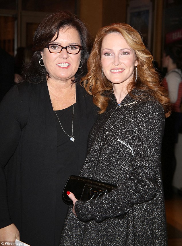 Finally over: Rosie O'Donnell and Michelle Rounds have reached a settlement in their divorce and will share custody of their adopted daughter. Thy're pictured in October 2014 before their split