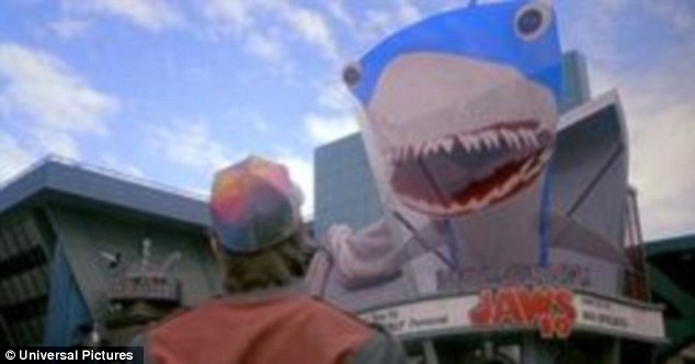 Almost as soon as Marty ventures out into downtown Hill Valley in 2015 he is faced with a billboard for Jaws 19 from which a shark appears to leap from the surface (pictured). 3D films and TVs are common place today and now researchers to have cracked the problem of creating giant 3D displays without the need for glasses