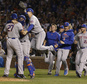 The New York Mets celebrate after Game 4 of the National League baseball championship series against the Chicago Cubs Wednesday, Oct. 21, 2015, in Chicago. The Mets won 8-3 to advance to the World Series. (AP Photo/Nam Y. Huh)