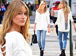 Hailey Baldwin was spotted in Soho on Thursday posing for a photoshoot for Express. She wore a stunning cutout white shirt and skinny jeans\n\nPictured: Hailey Baldwin\nRef: SPL1158375  221015  \nPicture by: 247PAPS.TV / Splash News\n\nSplash News and Pictures\nLos Angeles: 310-821-2666\nNew York: 212-619-2666\nLondon: 870-934-2666\nphotodesk@splashnews.com\n