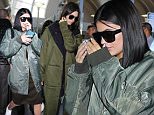 Wednesday, October 21, 2015 - Kendall and Kylie Jenner return from New York to Los Angeles after celebrating the launch of the Balmain x H&M collection.  The sisters rushed back to half-sister Khloe's side to support her as she monitors Lamar Odom's recover. The girls wore matching army green - Kylie's $1000 R13 oversided bomber and Kendall's Y3 duster made a fashion statement!\nJuliano-KMM-Jack-RS/X17online.com