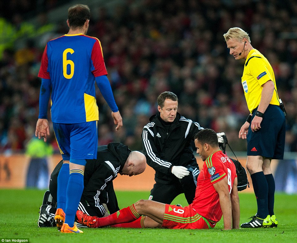 Reading forward Hal Robson-Kanu (pictured receiving medical treatment) was forced off through injury during the Euro 2016 qualifier