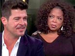 13 October 2013 - Los Angeles - USA\n\n\n\n**** STRICTLY NOT AVAILABLE FOR USA ***\n\n\n\nRobin Thicke talks to Oprah Winfrey about 'Twerking' wiht Miley Cyrus, his marriage and his career. The Blurred Lines singer appeared on Oprah's Next Chapter to talk frankly about the recent controversy surrounding his MTV VMA performance with Cyrus. And Thicke took no time in putting the blame for the controversial performance on Miley. He claimed he was simply 'twerked upon,' and was too busy focusing on his singing to see what Miley was doing. He told Oprah: "So to me, Iím walking out towards Miley, Iím not thinking sex, Iím thinking fun." Curious how that could even be possible, Oprah - who physically displayed her distaste for the situation - interrupted: "But she was twerking up against your kahoonas." And Thicke replied: "But you have to remember I'm singing my butt of, so I'm sitting there, I'm looking up at the sky, I'm singing. I'm not really paying attention to all that. That's on her.