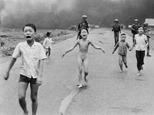 FILE - In this June 8, 1972, file photo, 9-year-old Kim Phuc, center, runs with her brothers and cousins, followed by South Vietnamese forces, down Route 1 near Trang Bang after a South Vietnamese plane accidentally dropped its flaming napalm on its own troops and civilians. The terrified girl had ripped off her burning clothes while fleeing. In late September 2015, Phuc, 52, began a series of laser treatments at the Miami Dermatology and Laser Institute to smooth and soften the pale, thick scar tissue that she has endured for more than 40 years. (AP Photo/Nick Ut, File)