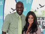 Lamar Odom and wife Khloe Kardashian arrive at the 2010 Teen Choice Awards at Gibson Amphitheatre on August 8, 2010 in Universal City, California.