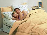 A stock photo of couple sleeping on a full-height airbed.
A full-height airbed for £89.99.