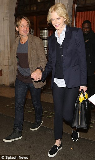 Happy couple: Exiting the West End venue later that night the actress looked understandably pleased as she headed home with Keith