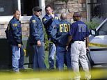 FBI agents talk outside the scene of a raid of the apartment of Najibullah Zazi at the Vistas Apartment Complex at 22959 East Smoky Hill Road in Aurora, Wednesday afternoon, September 16, 2009. Hyoung Chang, The Denver Post
