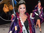 Demi Lovato was spotted arriving to her NYC hotel after attending a Halloween Party for MTV. She wore an extravagant Purple cape, Crown, and tiny black dress with a sash that read "Trap Queen". Her cape was covered in literal traps, including mouse traps and Bear traps . She looked stunning with purple eye shadow and a big smile.

Pictured: Demi Lovato
Ref: SPL1162053  261015  
Picture by: 247PAPS.TV / Splash News

Splash News and Pictures
Los Angeles: 310-821-2666
New York: 212-619-2666
London: 870-934-2666
photodesk@splashnews.com