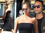 Picture Shows: Chrissy Teigen  October 26, 2015\n \n Pregnant model Chrissy Teigen is spotted out and about in Beverly Hills, California.\n \n Chrissy recently announced that she is expecting her first child with her husband, singer John Legend, and showed off her laid-back maternity style in a strapless black dress and flat black sandals with a gold snake embellishment.\n \n Non Exclusive\n UK RIGHTS ONLY\n \n Pictures by : FameFlynet UK © 2015\n Tel : +44 (0)20 3551 5049\n Email : info@fameflynet.uk.com