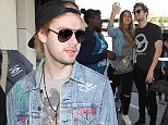 5 Seconds of Summer snaps pictures with fans before departing from Los Angeles International Airport (LAX)\nFeaturing: 5sos, 5 Seconds of Summer\nWhere: Los Angeles, California, United States\nWhen: 26 Oct 2015\nCredit: WENN.com