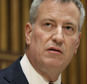 FILE - In this Oct. 21, 2015 file photo, New York City Mayor Bill de Blasio speaks during a media briefing in New York.  De Blasio, a Democrat, announced during a Friday, Oct. 30, 2015 appearance on MSNBC's "Morning Joe" that he's backing Hillary Rodham Clinton for president.  He called her the best candidate to address income inequality.(AP Photo/Seth Wenig)