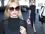 Los Angeles, CA - Kate Bosworth departs LAX looking up to date on trends as always in a black overall dress with a pop of color pink purse. \n  \nAKM-GSI      October 30, 2015\nTo License These Photos, Please Contact :\nSteve Ginsburg\n(310) 505-8447\n(323) 423-9397\nsteve@akmgsi.com\nsales@akmgsi.com\nor\nMaria Buda\n(917) 242-1505\nmbuda@akmgsi.com\nginsburgspalyinc@gmail.com