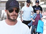 Please contact X17 before any use of these exclusive photos - x17@x17agency.com   David Beckham leaving Kitson after a mini-shopping spree with sons Brooklyn and Romeo. October 30, 2015 X17online.com EXCLUSIVE