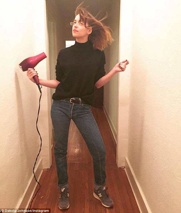 Funny girl: On Saturday, The Social Network star shared a photo of her blow drying her hair, captioning the snap: 'Blow jobs,' and adding a pumpkin emoji