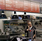 A woman talks on the phone as she stands in the kitchen area of a closed Chipotle restaurant, Monday, Nov. 2, 2015, in Seattle. An E. coli outbreak linked to Chipotle restaurants in Washington state and Oregon has sickened nearly two dozen people in the third outbreak of foodborne illness at the popular chain this year. Cases of the bacterial illness were traced to six of the fast-casual Mexican food restaurants, but the company voluntarily closed down 43 of its locations in the two states as a precaution. (AP Photo/Elaine Thompson)