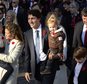 Prime Minister-designate Justin Trudeau, his wife Sophie Gregoire-Trudeau and their children Ella-Grace, Hadrien and Xavier lead the new Liberal cabinet to Rideau Hall in Ottawa on Wednesday, Nov. 4, 2015.  Trudeau has been sworn in as Canada's next prime minister, following in the footsteps of his storied father.  (Sean Kilpatrick/The Canadian Press via AP) MANDATORY CREDIT