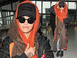 Picture Shows: Rita Ora  November 11, 2015
 
 'Body On Me' Singer Rita Ora seen arriving at Heathrow Airport in London, England.
 
 Rita was dressed casually in a black bomber jacket, ripped jeans and lace up boots as she covered her head with an orange and brown scarf.
 
 Exclusive - All Round
 WORLDWIDE RIGHTS
 Pictures by : FameFlynet UK © 2015
 Tel : +44 (0)20 3551 5049
 Email : info@fameflynet.uk.com