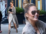 11/15/15 NYC - Mom to be Chrissy Teigen is seen in Soho wearing earth tone color outfit with a skirt with slit revealing her legs with laced heels; stepping out with her mom Vilailuck Teigen, in which later Chrissy attemtps to pull a locked door of an office building on Sunday November 15th, 2015. Non Exclusive / Luis Yllanes / Splash News\n\nPictured: Chrissy Teigen, Vilailuck Teigen\nRef: SPL1173518  151115  \nPicture by: Luis Yllanes / Splash News\n\nSplash News and Pictures\nLos Angeles: 310-821-2666\nNew York: 212-619-2666\nLondon: 870-934-2666\nphotodesk@splashnews.com\n
