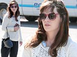 145008, EXCLUSIVE: Zooey Deschanel bundles up as she goes out and about in LA, while her husband Jacob Pechenik seems impervious to the windy weather on a  shirtless bike ride.  Los Angeles, California- Sunday November 15, 2015. Photograph: © KVS, PacificCoastNews. Los Angeles Office: +1 310.822.0419 sales@pacificcoastnews.com FEE MUST BE AGREED PRIOR TO USAGE