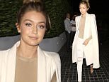 West Hollywood, CA - Gigi Hadid flashes a smile as she arrives for a dinner party with her Kardashian friends at Cecconi's in West Hollywood. The 20-year-old model looked classy in a white coat over a beige top, ripped skinny white jeans and a pair of nude high heels.\nAKM-GSI         November 19, 2015\nTo License These Photos, Please Contact :\nSteve Ginsburg\n(310) 505-8447\n(323) 423-9397\nsteve@akmgsi.com\nsales@akmgsi.com\nor\nMaria Buda\n(917) 242-1505\nmbuda@akmgsi.com\nginsburgspalyinc@gmail.com