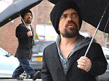 NEW YORK, NY - NOVEMBER 19:  Actor Peter Dinklage is seen walking in the rain in Soho on November 19, 2015 in New York City.  (Photo by Raymond Hall/GC Images)