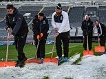 NEWCASTLE, ENGLAND - NOVEMBER 21:  Newcastle United groundsmen shovel ice off the pitch prior to the Barclays Premier League match between Newcastle United and Leicester City at St.James' Park on November 21, 2015, in Newcastle upon Tyne, England. (Photo by Serena Taylor/Newcastle United via Getty Images)