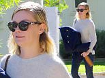 Toluca Lake, CA - Kirsten Dunst shares a smile as she leaves a friends house.  Kirsten has her hands full as she walk out carrying her coat and a gold bottle.\nAKM-GSI          November 19, 2015\nTo License These Photos, Please Contact :\nSteve Ginsburg\n(310) 505-8447\n(323) 423-9397\nsteve@akmgsi.com\nsales@akmgsi.com\nor\nMaria Buda\n(917) 242-1505\nmbuda@akmgsi.com\nginsburgspalyinc@gmail.com