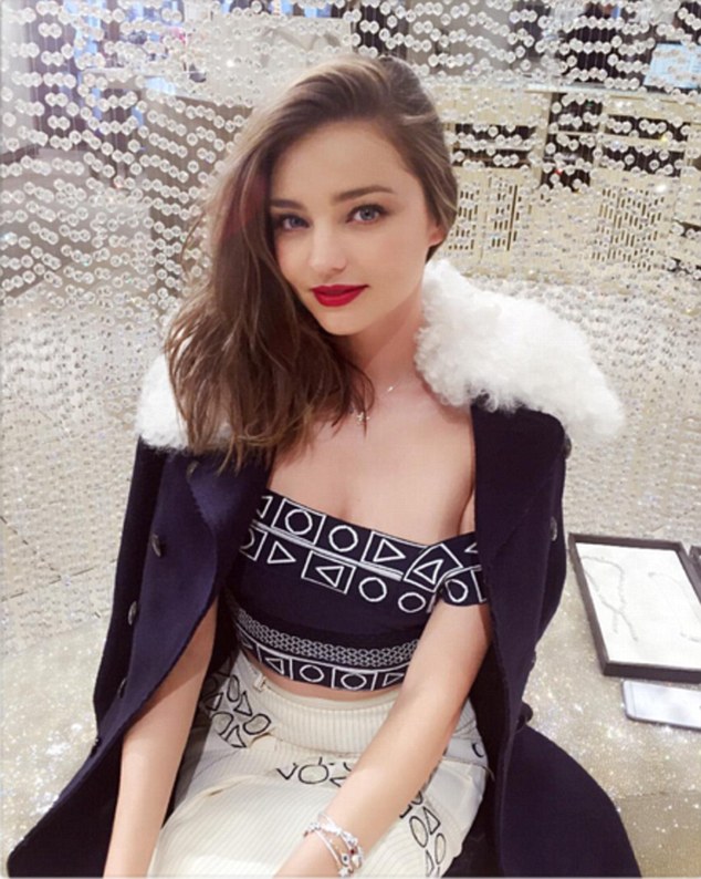 Festive fashion: The Swarovski spokesmodel recently looked absolutely sensational in a geometric-print, off-the-shoulder garment and a matching white skirt