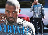 Picture Shows: Kanye West  November 19, 2015\n \n Rapper and busy dad Kanye West is spotted chatting on his cellphone at his office in Calabasas, California. Kanye was showing off a rocker look, sporting a torn Nirvana shirt. \n \n Non Exclusive\n UK RIGHTS ONLY\n \n Pictures by : FameFlynet UK © 2015\n Tel : +44 (0)20 3551 5049\n Email : info@fameflynet.uk.com