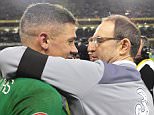 epa05028862 Ireland manager Martin O'Neill (R) celebrates with Jon Walters (L) after the UEFA EURO 2016 qualification playoff second leg soccer match between Ireland and Bosnia and Herzegovina in Dublin, Ireland, 16 November 2015. Ireland won 3-1 on aggregate to qualify for the UEFA EURO 2016.  EPA/AIDAN CRAWLEY