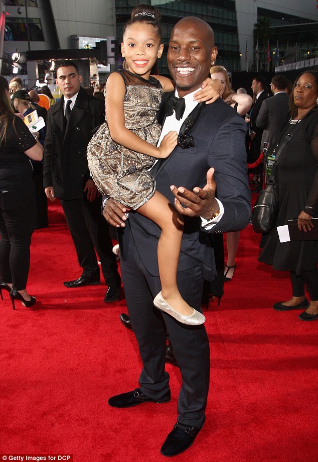 Doting dad: Tyrese Gibson slipped into a different role on the red carpet at the 2015 American Music Awards in Los Angeles on Sunday evening, as he played the doting father to daughter Shayla