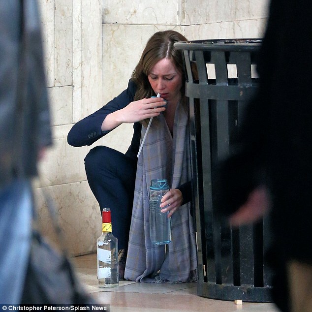 Focus: Actress Emily Blunt knelt behind a trash can and appeared to fill her water bottle with vodka as she filmed scenes for The Girl On The Train in New York City on Sunday