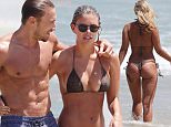 **EXCLUSIVE**\nA Bikini a day Natasha Oakley is spotted one the beach with her new french boyfriend.