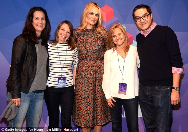 All together now: The model poses with event attendees on Saturday