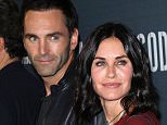 LOS ANGELES, CA - AUGUST 19:  Musician Johnny McDaid (L) and actress Courteney Cox attend the premiere of Amazon's Series "Hand of God" at Ace Theater Downtown LA on August 19, 2015 in Los Angeles, California.  (Photo by David Livingston/Getty Images)