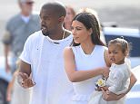 ****File Photos** KIM KARDASHIAN and KANYE WEST have welcomed their baby boy.
Their little bundle of joy was delivered on Saturday morning (05Dec15) without complications, a week after Kim underwent a medical procedure to turn her breech baby around.
The new parents have yet to reveal a name, but the reality TV star was quick to post the happy news on her website.
"KANYE AND I WELCOME OUR BABY BOY!" she wrote excitedly.
Kim also took to Twitter, writing, ìHeís here!î, alongside a touching snap of her holding hands with Kanye.
ìKim Kardashian West and Kanye West welcomed the arrival of their son this morning. Mother and son are doing well,î a statement on her website confirms.
Their son is a baby brother for two-year-old North. Just like their daughter, the baby was born a little early, as Kim was reportedly due to give birth on Christmas Day (25Dec15).
It seemed the star was getting impatient, as she posted a picture to her Twitter page on Friday (04Dec15), showing off her big baby bu