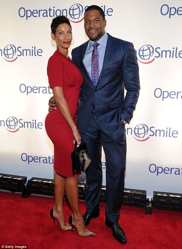 Case of the ex: Nicole split from her fiancé Michael Strahan last year, following a five-year engagement (pictured in 2014) and officially divorced Eddie Murphy in 2006
