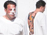 Picture Shows: Ben Affleck  December 08, 2015\n \nActor Ben Affleck is spotted on the set of his new movie 'Live By Night' looking beaten and bruised in Los Angeles, California. \n \n Ben, who was also sporting a large tattoo on his back, was seen enjoying a cigarette outside of his trailer between takes.\n \n ** Min Web / Online Fee £400 For Set **\n \n \n Exclusive All Rounder\n UK RIGHTS ONLY\n Pictures by : FameFlynet UK © 2015\n Tel : +44 (0)20 3551 5049\n Email : info@fameflynet.uk.com