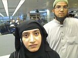 Tashfeen Malik, (L), and Syed Farook are pictured passing through Chicago's O'Hare International Airport in this July 27, 2014 handout file photo. A couple who massacred 14 people at a California holiday party were discussing martyrdom online before they met in person and married, FBI Director James Comey said on December 9, 2015.  REUTERS/U.S. Customs and Border Protection/Handout   THIS IMAGE HAS BEEN SUPPLIED BY A THIRD PARTY. IT IS DISTRIBUTED, EXACTLY AS RECEIVED BY REUTERS, AS A SERVICE TO CLIENTS. FOR EDITORIAL USE ONLY. NOT FOR SALE FOR MARKETING OR ADVERTISING CAMPAIGNS