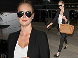Supermodel, Kate Upton arrives in Los Angeles wearing skinny jeans, a black blazer & a lowcut blouse.  The sexy model/actress was seen at LAX making her way to a waiting limo. 

Pictured: Kate Upton
Ref: SPL1194514  111215  
Picture by: Sharky / Splash News

Splash News and Pictures
Los Angeles: 310-821-2666
New York: 212-619-2666
London: 870-934-2666
photodesk@splashnews.com