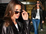 Cindy Crawford wore jeans and a leather jacket for her flight into LAX.  The supermodel had also pulled on a t-shirt repping Violet Gray's Hair So Good It Should Be Insured line.  Friday, December 11, 2015 X17online.com