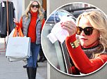 Reese Witherspoon wore a puffy down vest over a red sweater , with jeans, for a quick holiday shopping trip, in Beverly Hills, on Friday, December 11, 2015 X17online.com