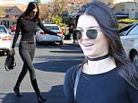 Kendall Jenner hits Barnes And Nobel for some holiday shopping. The supermodel decked out in entirely black and wearing a choker around her neck, can't hold back a huge smile upon leaving with a mystery man. Saturday, December 12, 2015. X17online