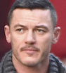 Looking good: The Hobbit actor Luke Evans looked smart in a blazer and snood as he chatted on the phone in New York City.