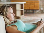 A stock photo of a woman laying on sofa and texting with cell phone. 

Image shot 2013. Exact date unknown.
