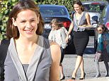 Please contact X17 before any use of these exclusive photos - x17@x17agency.com   EXCLUSIVE - Jennifer Garner is all smiles as she runs errands and carries a tray of holiday cookies with children Violet, Seraphina and Samuel in Brentwood, CA. Jennifer looks lovely in a grey sleevless blouse, pencil skirt and high heels. Sunday, December 13, 2015. X17online.com