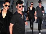 EXCLUSIVE: Robin Thicke and girlfriend April Love Geary hold hands as they stroll through the terminal at LAX airport in Los Angeles, CA.\n\nPictured: Robin Thicke and April Love Geary\nRef: SPL1196350  141215   EXCLUSIVE\nPicture by: Diabolik / Splash News\n\nSplash News and Pictures\nLos Angeles: 310-821-2666\nNew York: 212-619-2666\nLondon: 870-934-2666\nphotodesk@splashnews.com\n